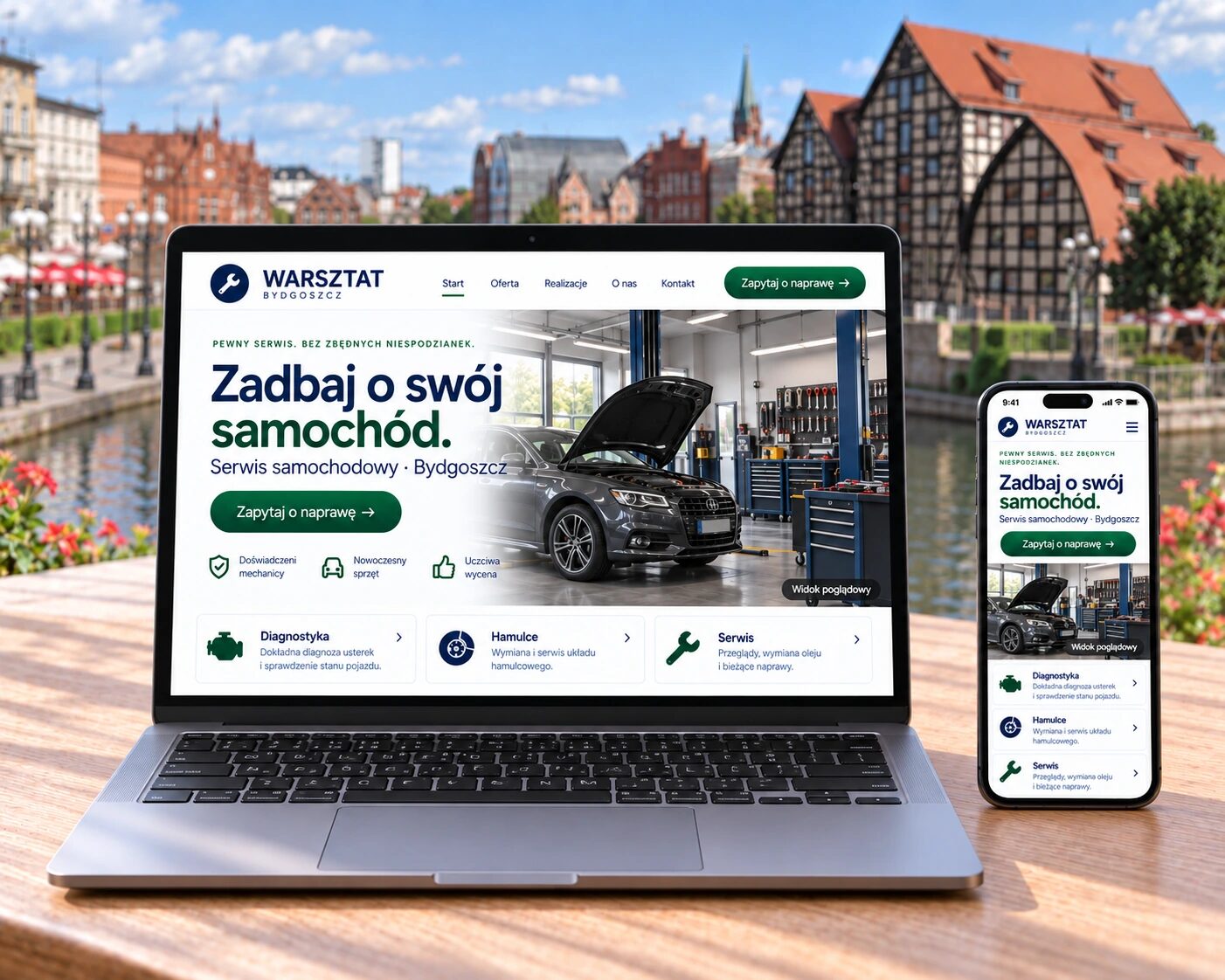 Przykładowa strona warsztatu samochodowego na laptopie i telefonie, na tle spichrzy nad Brdą w Bydgoszczy.